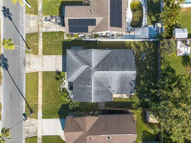 a view of swimming pool with outdoor seating and yard