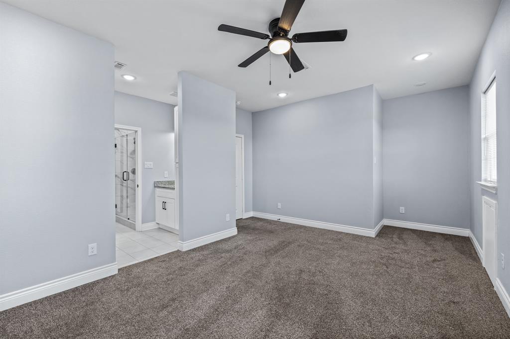 1701 Belzise Terrace Fort Worth, TX 76104 - Photo 15 of 35 wooden floor in an empty room with a ceiling fan