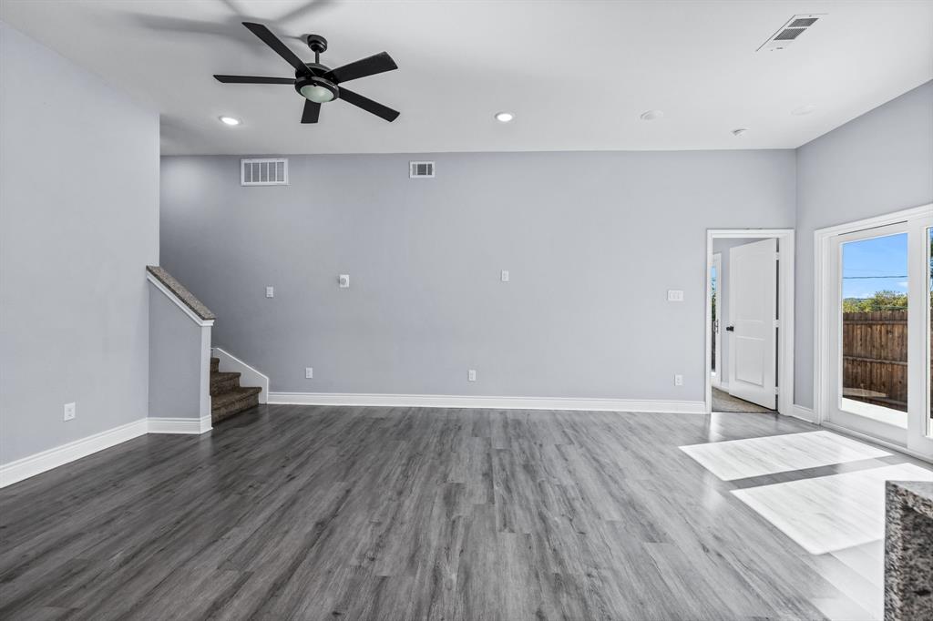 1701 Belzise Terrace Fort Worth, TX 76104 - Photo 25 of 35 wooden floor in an empty room with a window