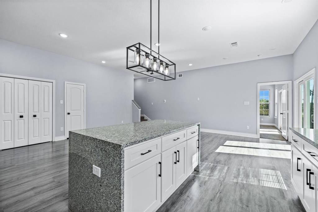 1701 Belzise Terrace Fort Worth, TX 76104 - Photo 26 of 35 a kitchen that has a lot of cabinets in it