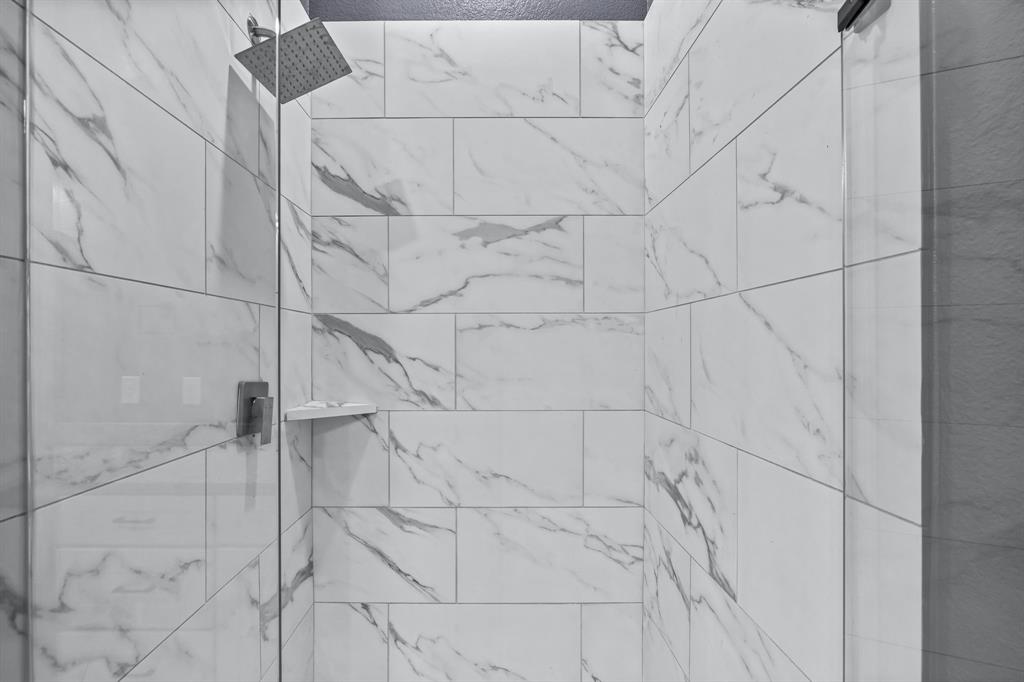 1701 Belzise Terrace Fort Worth, TX 76104 - Photo 5 of 35 a bathroom with a shower