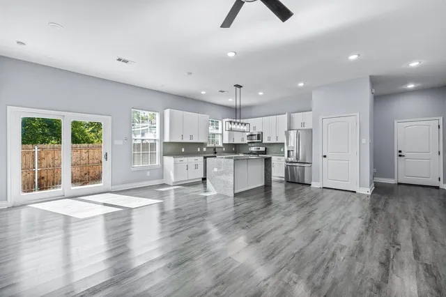 a view of kitchen with wooden floor and window