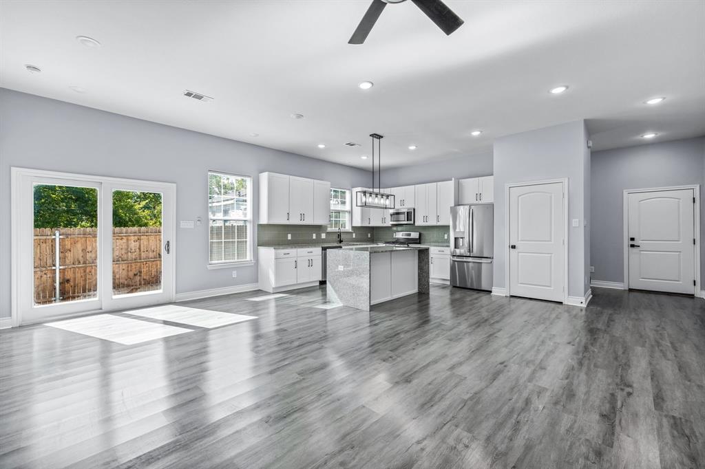 1701 Belzise Terrace Fort Worth, TX 76104 - Photo 6 of 35 a view of kitchen with wooden floor and window