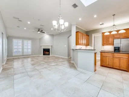 a bedroom with a large bed and a flat screen tv