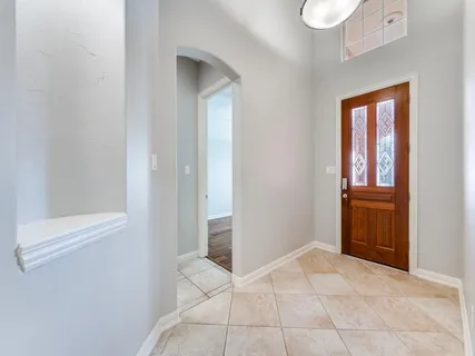 a dining room with furniture and chandelier