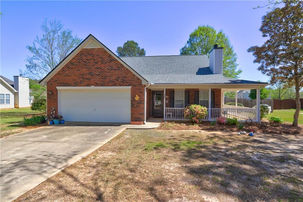 30 Windpher Ridge Hampton, GA 30228 - Photo 1 of 1 a front view of a house with yard and porch