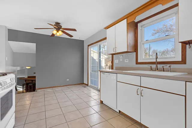 a kitchen with a sink cabinets and appliances