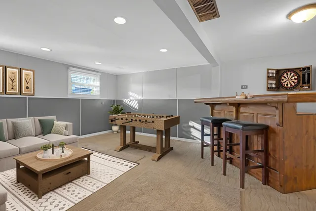 a living room with furniture and a rug