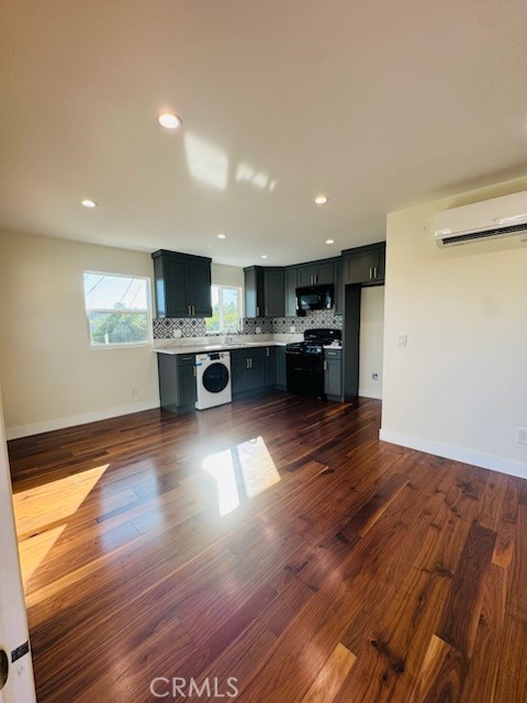 3015 Future Street Los Angeles, CA 90065 - Photo 17 of 22 a view of kitchen with kitchen island a sink wooden floor and living room view