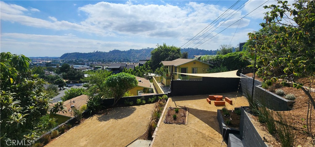 3015 Future Street Los Angeles, CA 90065 - Photo 7 of 22 a view of a balcony with two chairs and a potted plant