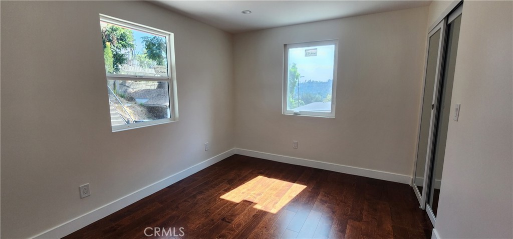 3015 Future Street Los Angeles, CA 90065 - Photo 10 of 22 an empty room with wooden floor and windows