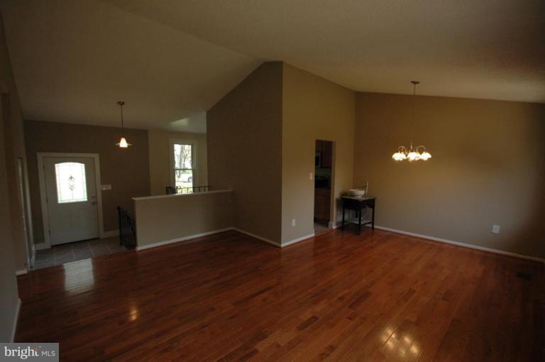 3761 Stonesboro Road Fort Washington, MD 20744 - Photo 11 of 30 a view of an empty room with wooden floor and a window