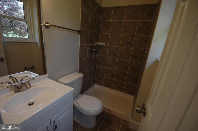 3761 Stonesboro Road Fort Washington, MD 20744 - Photo 13 of 30 a bathroom with a sink toilet and shower