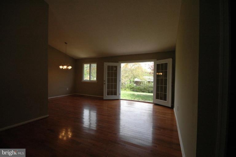 3761 Stonesboro Road Fort Washington, MD 20744 - Photo 15 of 30 a view of an empty room with wooden floor and a window