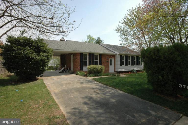 3761 Stonesboro Road Fort Washington, MD 20744 - Photo 18 of 30 a front view of a house with yard and green space