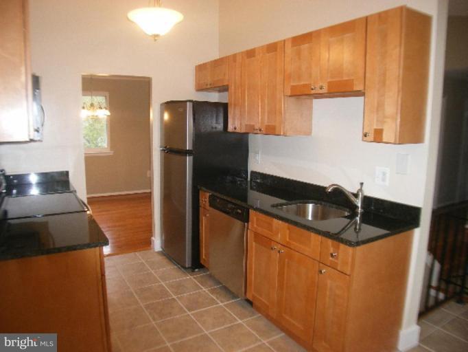 3761 Stonesboro Road Fort Washington, MD 20744 - Photo 4 of 30 a kitchen with granite countertop a sink a stove and refrigerator