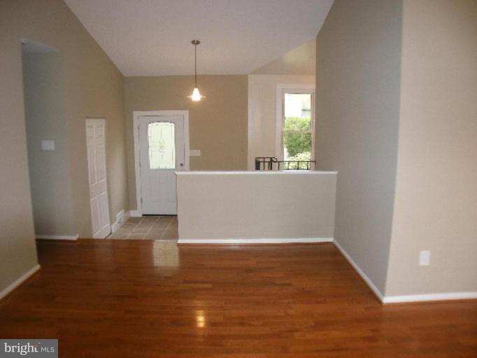 3761 Stonesboro Road Fort Washington, MD 20744 - Photo 7 of 30 an empty room with wooden floor and windows