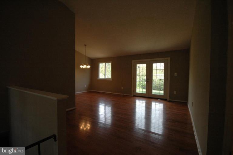 3761 Stonesboro Road Fort Washington, MD 20744 - Photo 10 of 30 a view of an empty room with wooden floor and a window