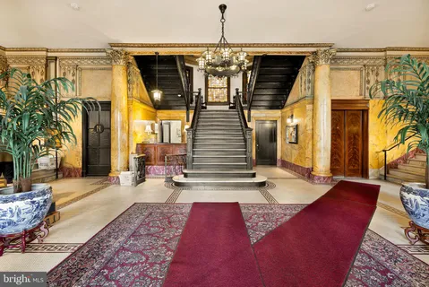 a view of a patio with couches and potted plants