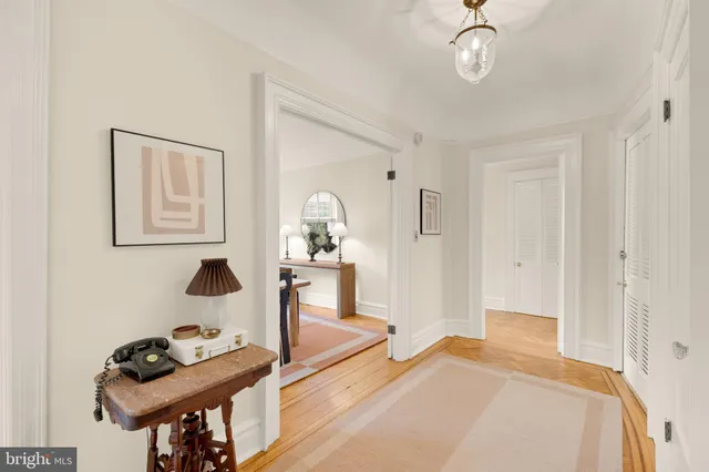 a bedroom with furniture and a mirror