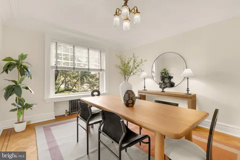 a view of a dining room with furniture window and wooden floor