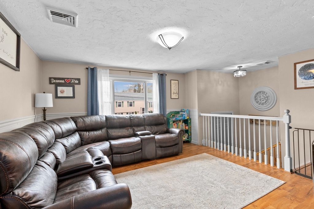 5 Len Road Holbrook, MA 02343 - Photo 8 of 30 a living room with furniture and a window