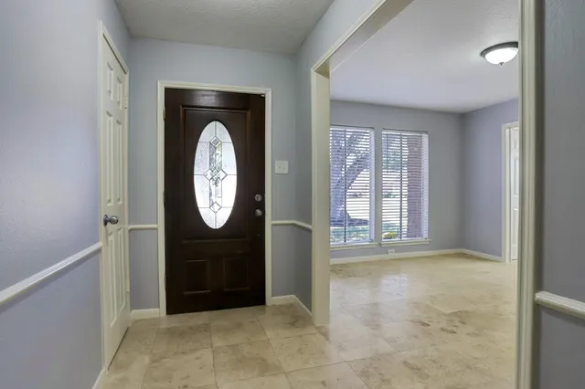 a view of an entryway with wooden floor