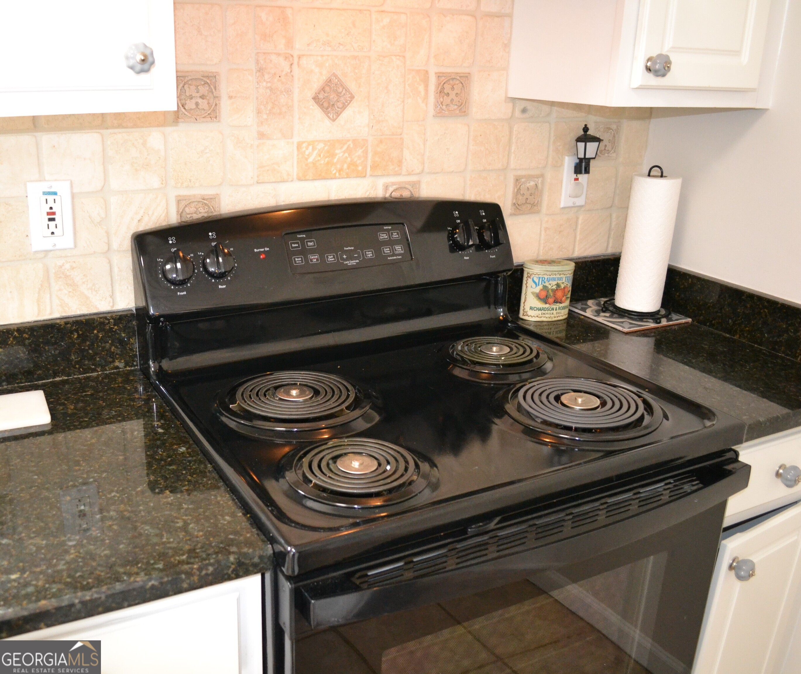 1467 Elders Mill Road, Unit ABOVE Senoia, GA 30276 - Photo 11 of 18 a stove top oven sitting inside of a kitchen