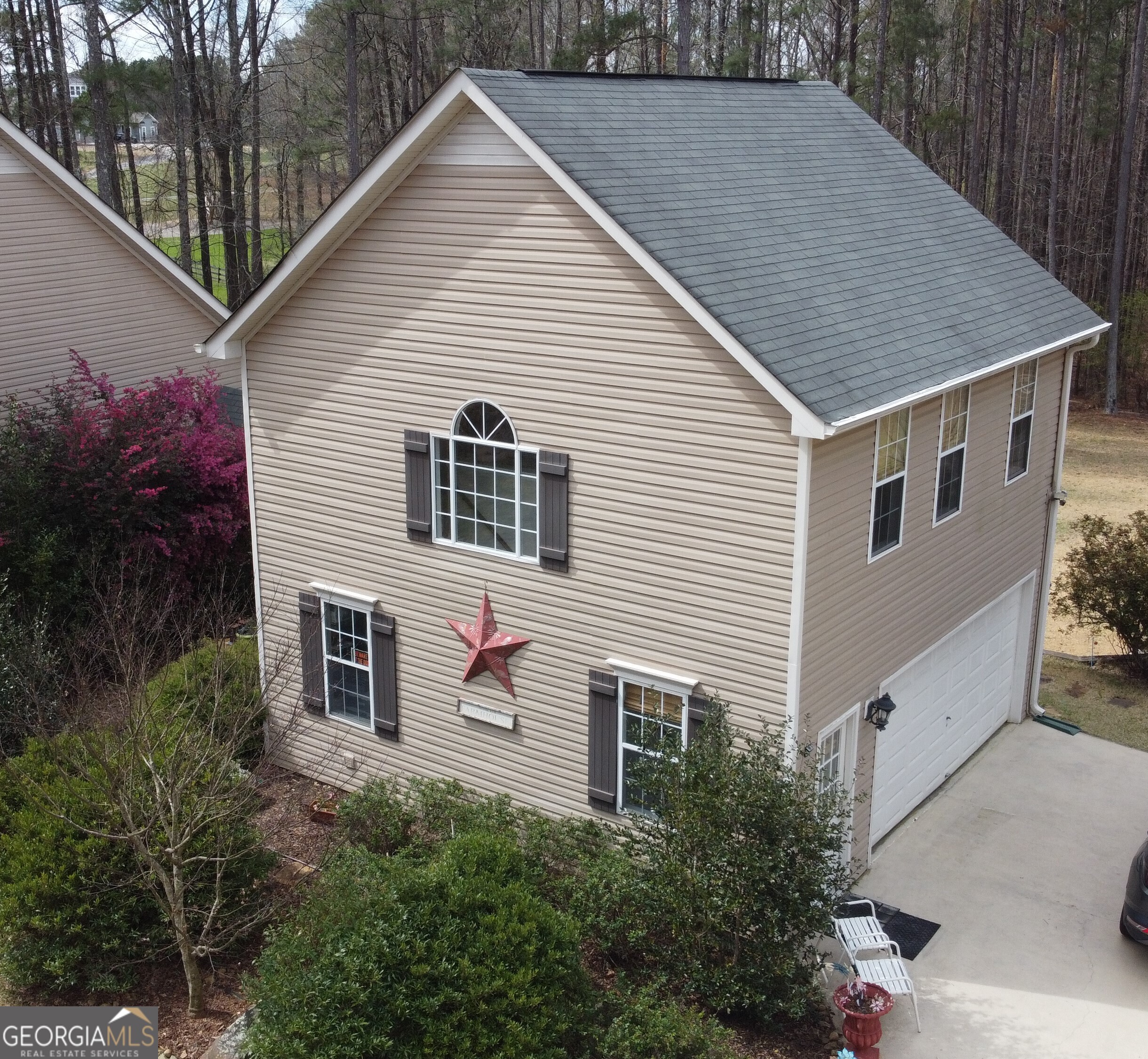1467 Elders Mill Road, Unit ABOVE Senoia, GA 30276 - Photo 2 of 18 a aerial view of a house with yard and trees in the background