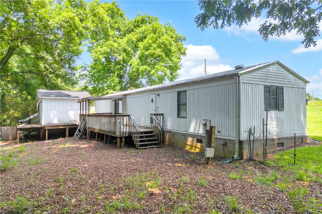 150 Newberry Road Walhalla, SC 29691 - Photo 30 of 47 A manufactured home with a spacious deck offers comfortable outdoor living.