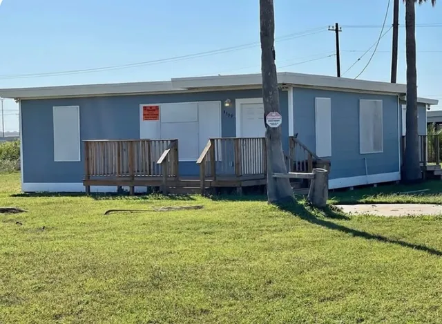 a spacious bathroom with a granite countertop sink and a mirror