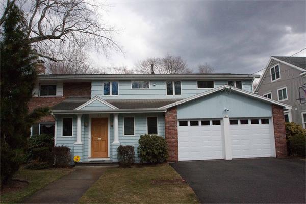 64 Damon Road Needham, MA 02494 - Photo 18 of 19 a front view of a house with a yard