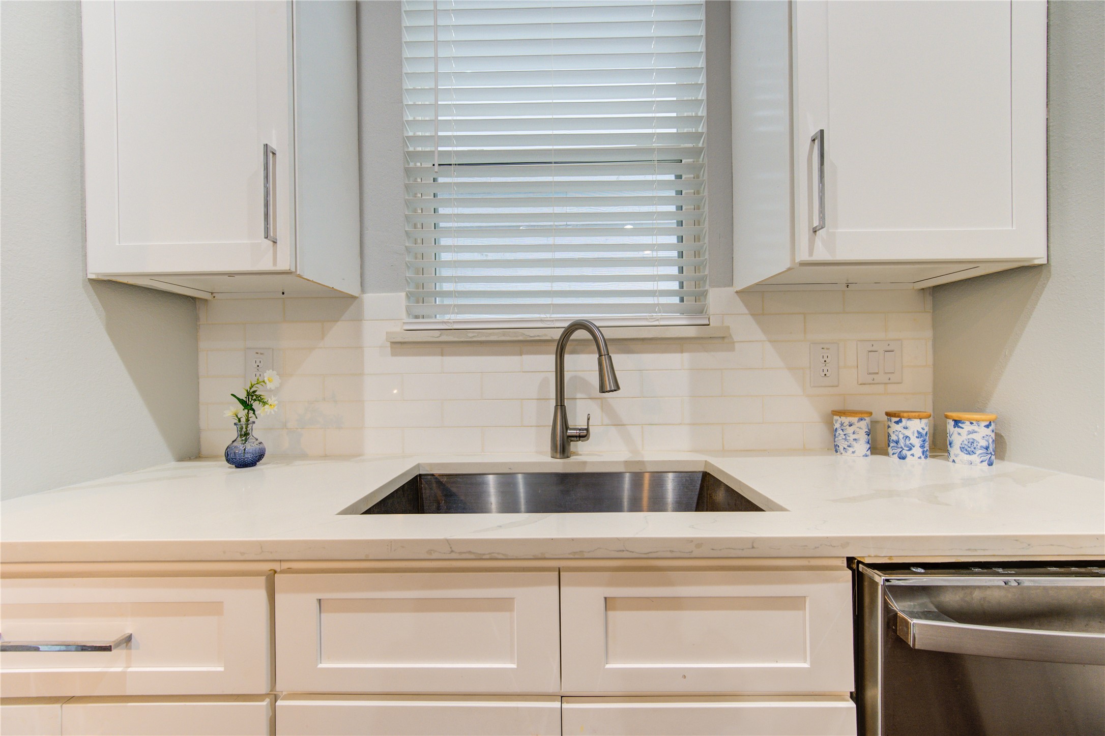 847 Rachel Street, Unit G Houston, TX 77091 - Photo 12 of 42 Thoughtfully planned kitchen layout with the sink, dishwasher, and window strategically placed together for added convenience and efficiency.