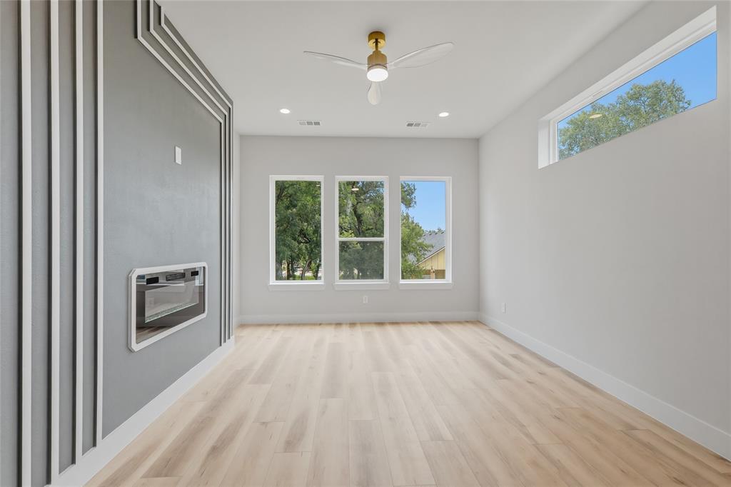 3914 Harlingen Street Dallas, TX 75212 - Photo 17 of 28 a view of an empty room with a window and a kitchen