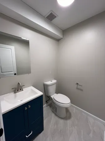 a bathroom with a sink and a toilet