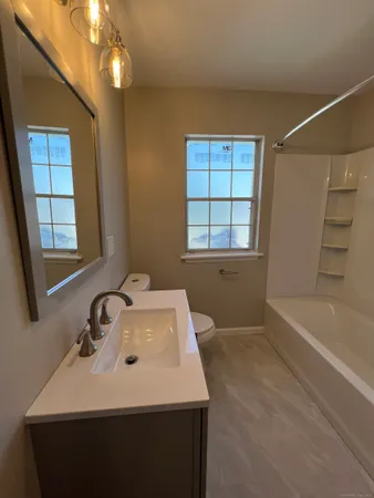 a bathroom with a sink a bathtub and a shower