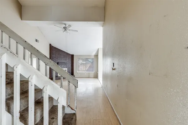 a view of a hallway with staircase
