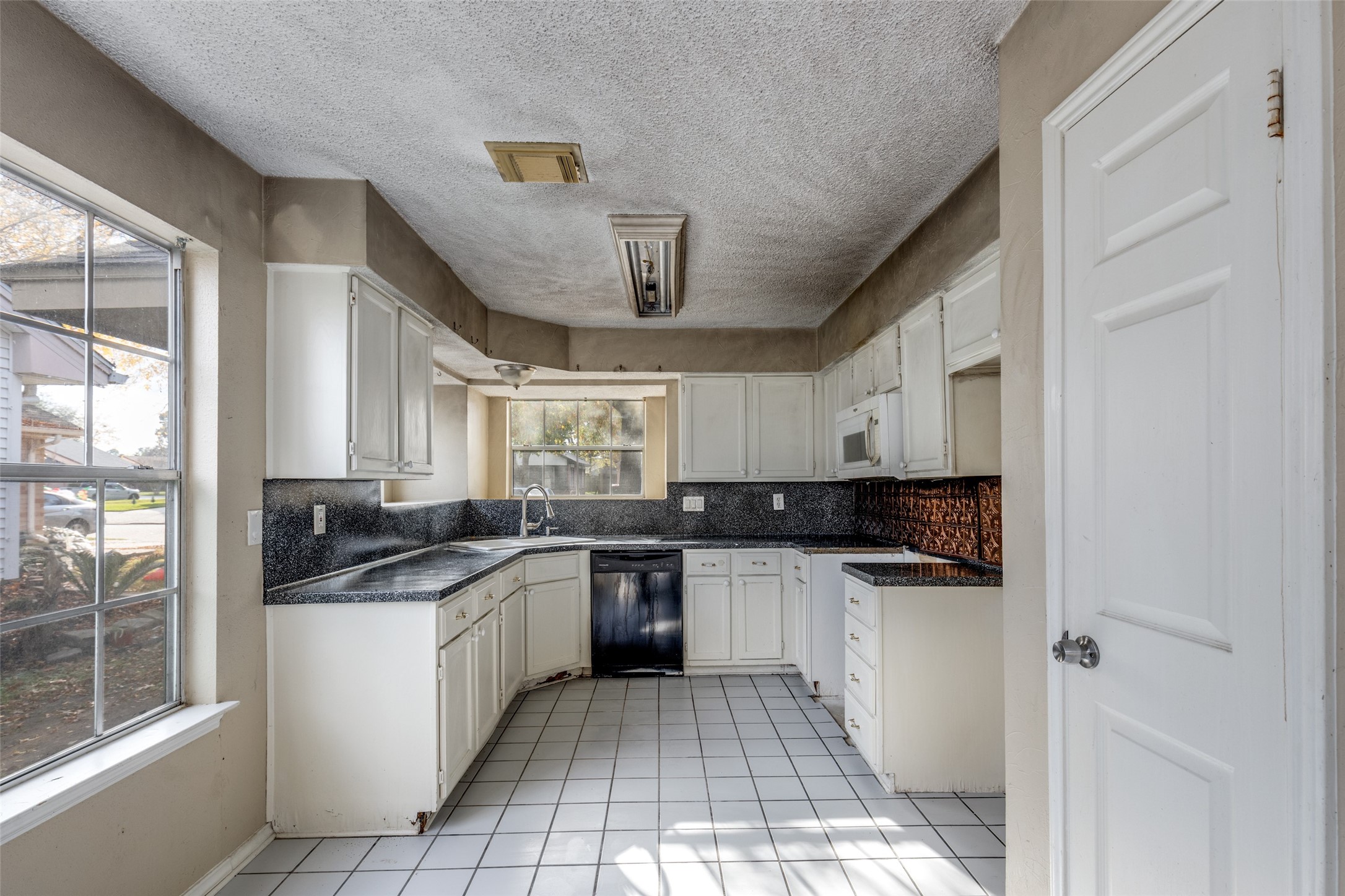 24010 Landing Way Drive Spring, TX 77373 - Photo 7 of 25 a kitchen with stainless steel appliances granite countertop a sink and cabinets