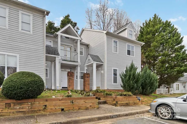 a front view of a house with parking