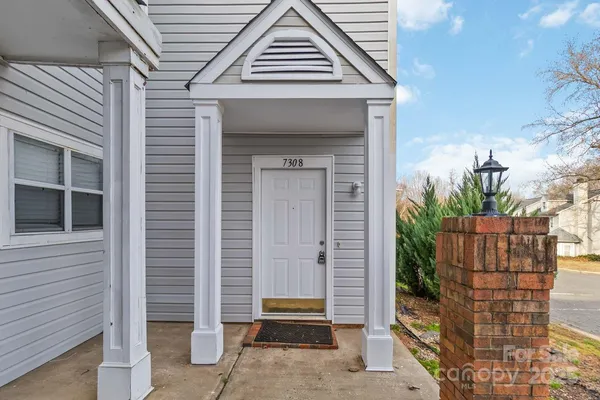 a front view of a house with a door and garage