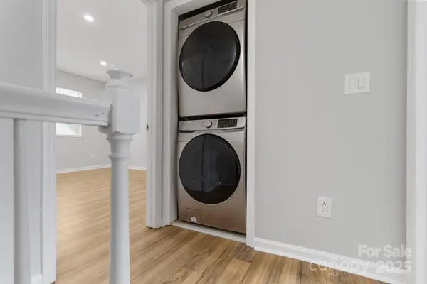 a view of a hallway with washer and dryer