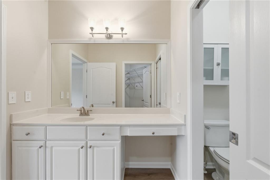 4533 Caleb Crossing, Unit 18 Powder Springs, GA 30127 - Photo 15 of 24 a bathroom with a sink vanity and a mirror