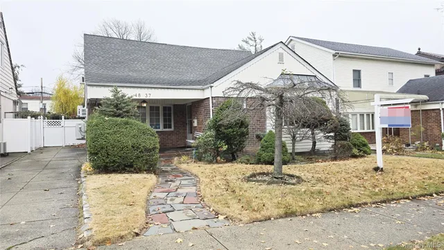 a view of a house with snow on the road
