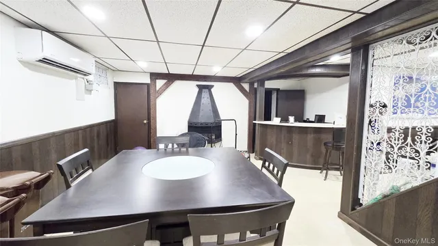 a room with table chairs and entryway