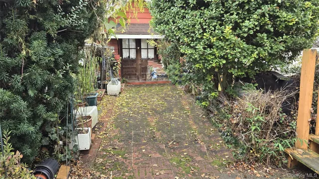 a living room with furniture a flat screen tv and a table
