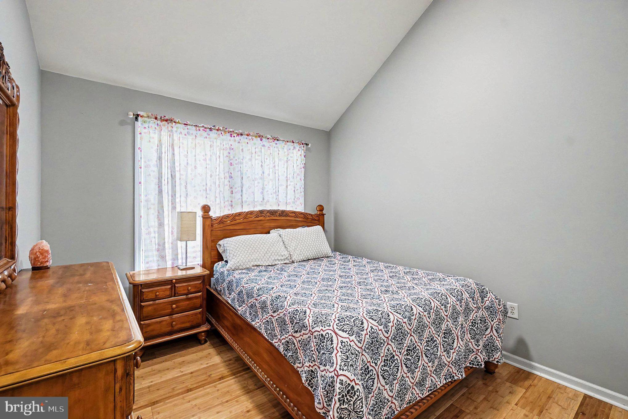64 Open Meadow Court Elkton, MD 21921 - Photo 23 of 57 a bedroom with a bed and wooden floor