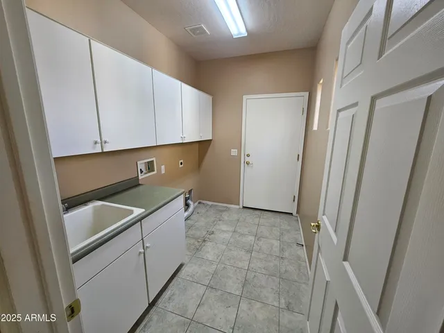 a bathroom with a sink a toilet and shower a mirror