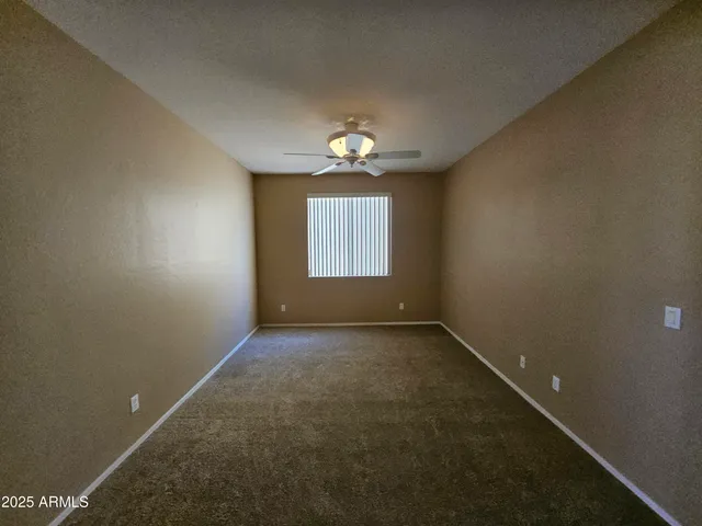 an empty room that has a window in it