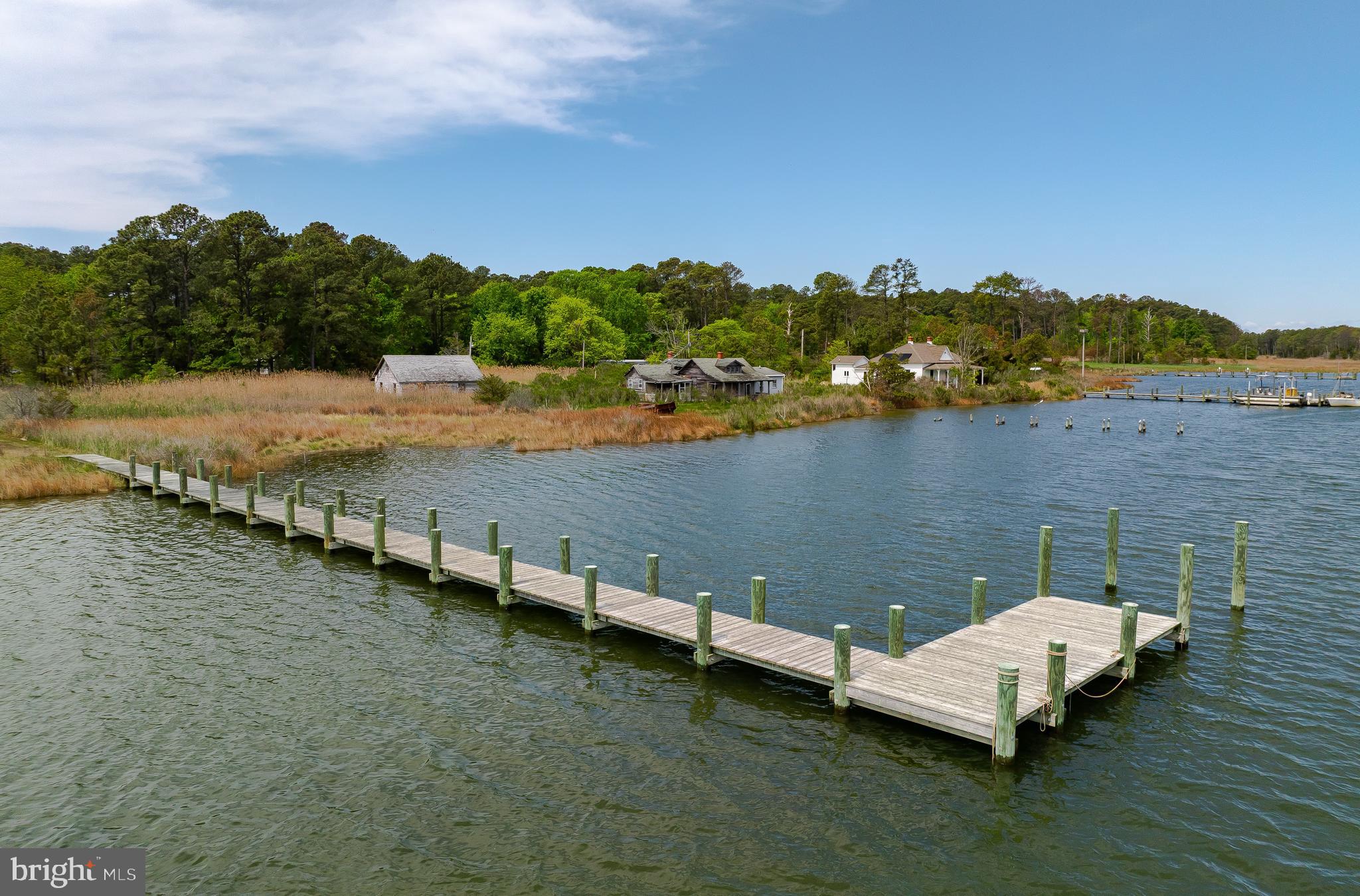 16146 Thomas Road Piney Point, MD 20674 - Photo 51 of 57 a view of a lake with houses with outdoor space