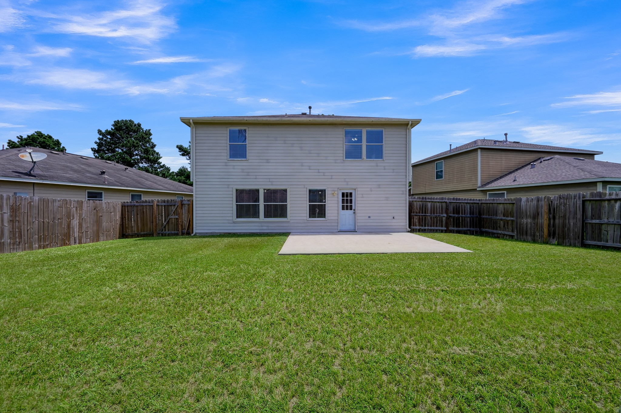 23919 Kingbriar Drive Spring, TX 77373 - Photo 32 of 33 Enjoy a spacious backyard complete with a concrete patio—perfect for grilling, relaxing, or entertaining family and friends.